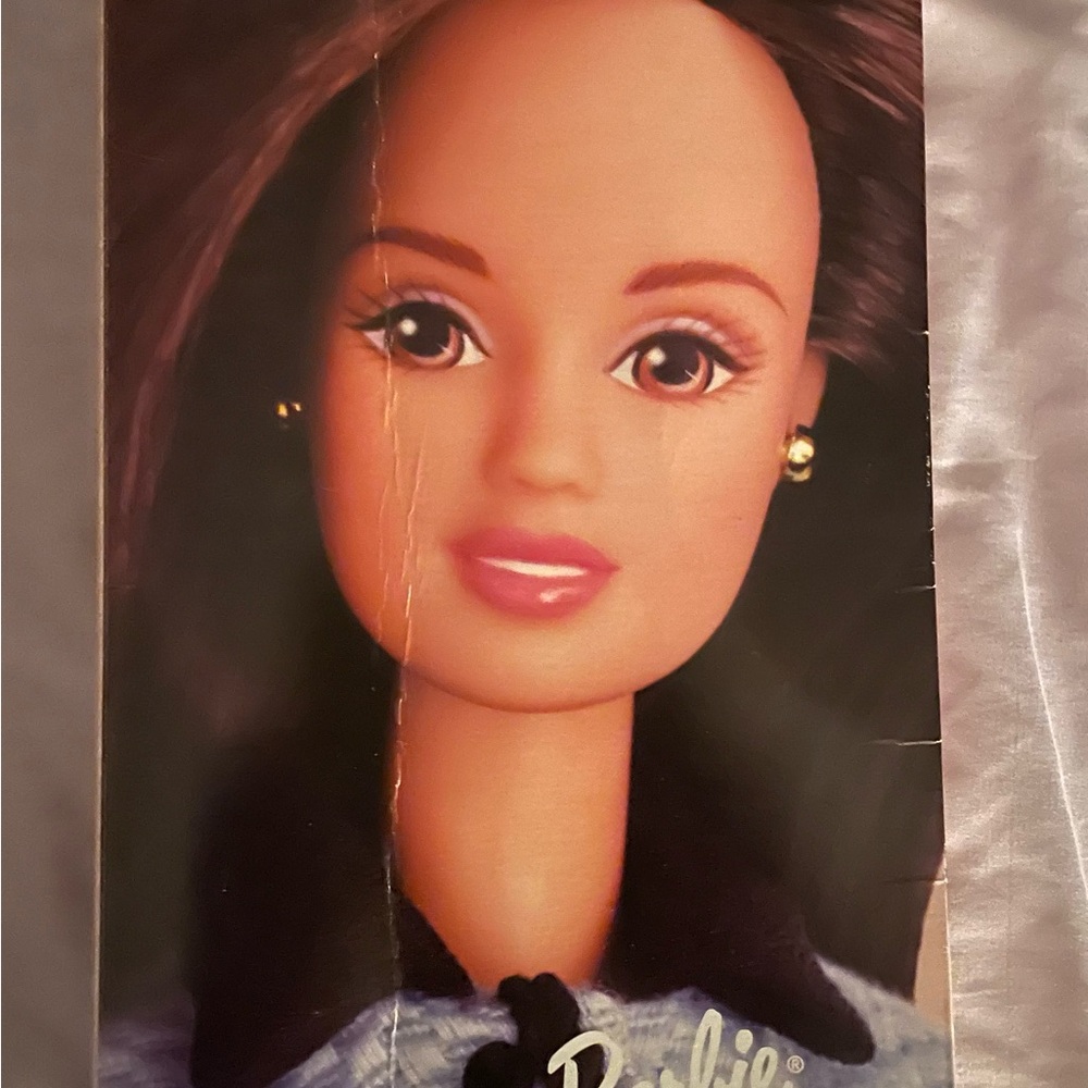 Avon Barbie doll with stand.